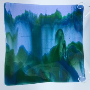 9x9 inch blue and green cascade plate on a neo-lavender background