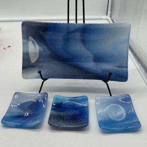 Sushi platter and dipping dishes honoring the blues of sea and sky