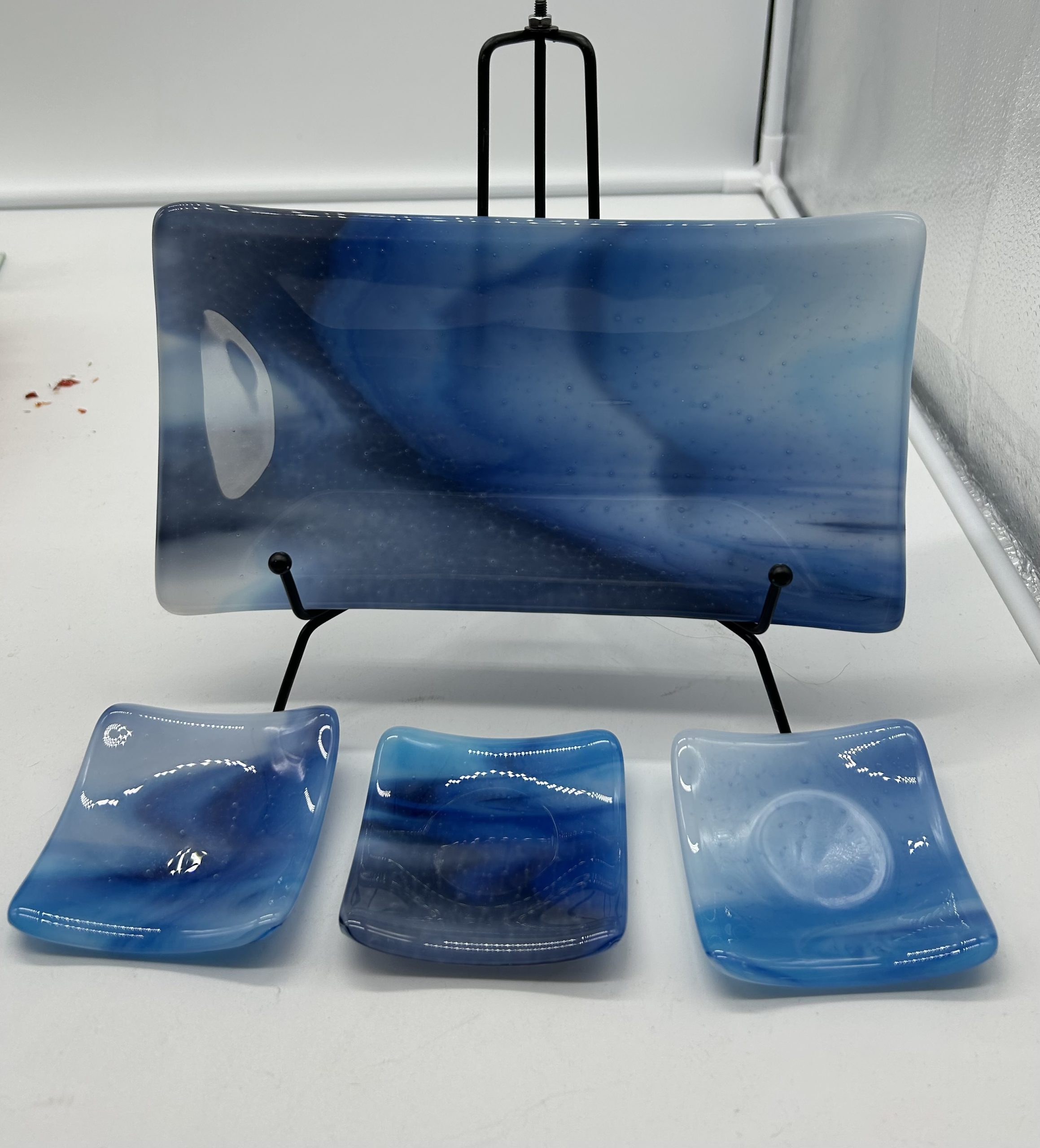 Sushi platter and dipping dishes honoring the blues of sea and sky